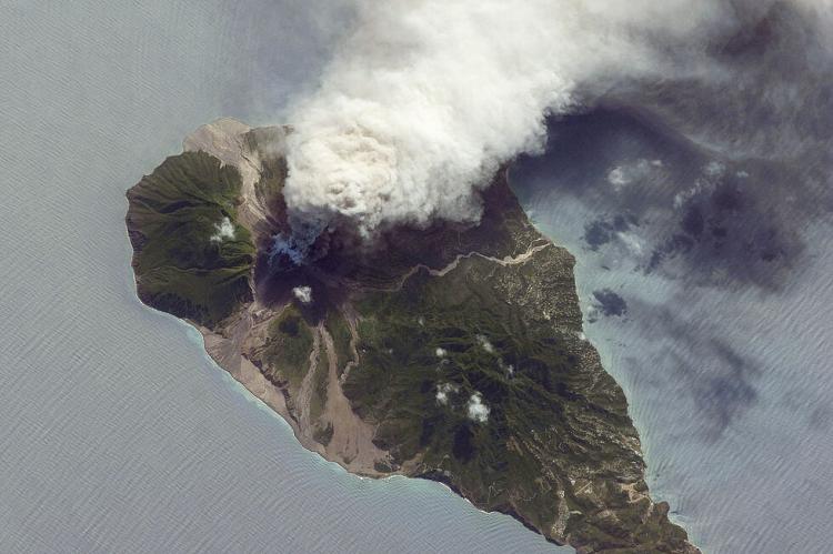 Soufrière Hills volcanio - NASA photo: the International Space Station (ISS) captures a white-to-grey ash and steam plume extending westwards from the volcano, 2009
