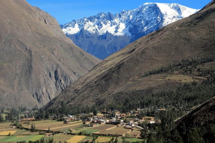 The eternal snows of the Andes rise above the Sacred Valley near Ollantaytambo, Peru
