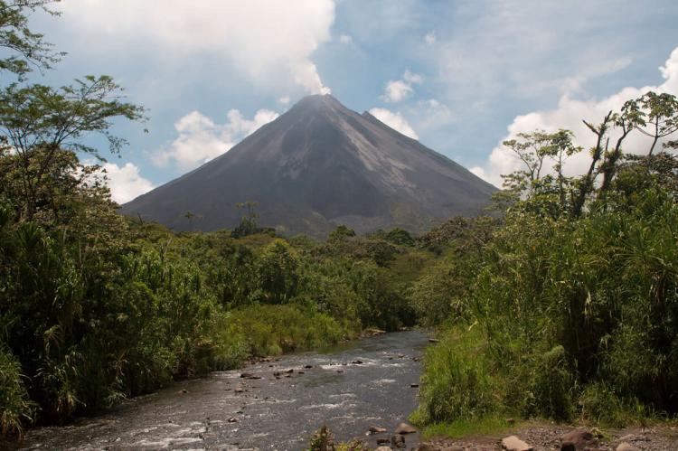 Arenal Volcano from a stream bed in Arenal Volcano National Park, Costa Rica