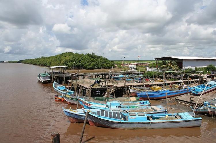 Vessels at dock on the Berbice River in Guyana 
