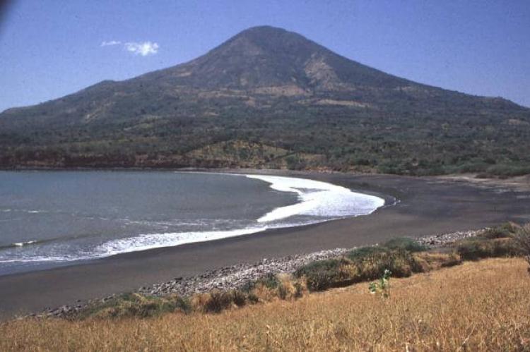 Conchagua (volcano) towers above sandy beaches along the Gulf of Fonseca at the SE tip of El Salvador