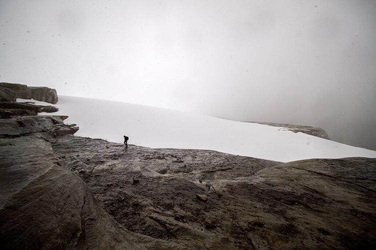 Hiker reaches the glacier atop Ritak U'wa Blanco in Sierra Nevada de Cocuy National Park, Colombia