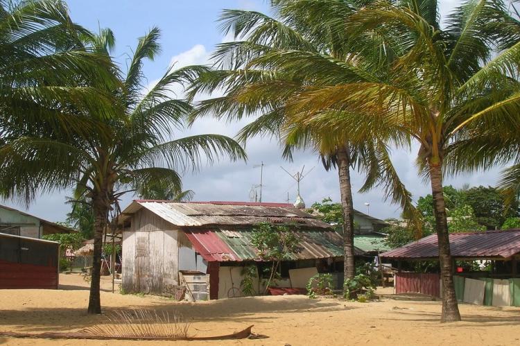 Typical Amerindien houses on the beach in Kourou, French Guiana