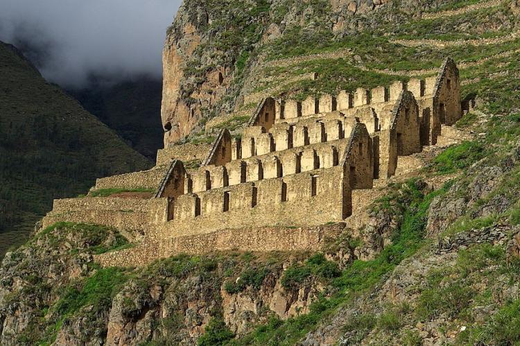 Ruins of Inca granaries on Ollantaytambo hillside, Peru