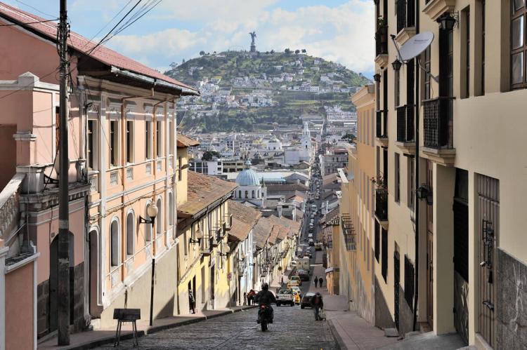 Quito, Ecuador, García Moreno street in historic center, Virgin of Quito in background