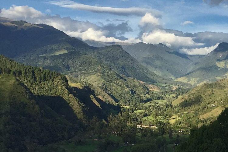 View of Valle del Cócora with mountains and clouds, Colombia