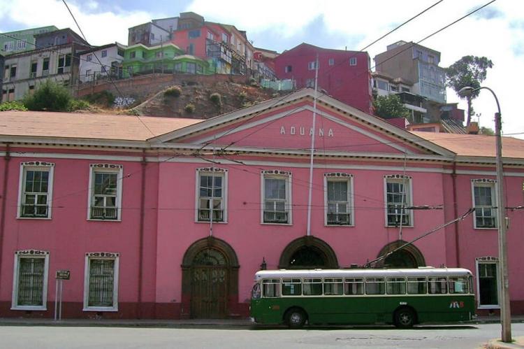 Trolleybus with the Customs House in the background in Valparaíso, Chile