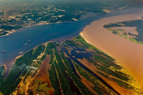 "Meeting of the waters" Río Negro joins the Amazon River, Manaus, Brazil