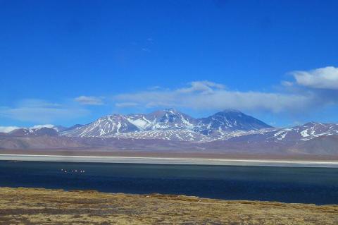 Panorama of Santa Rosa Lagoon with peaks of Nevado Tres Cruces in background